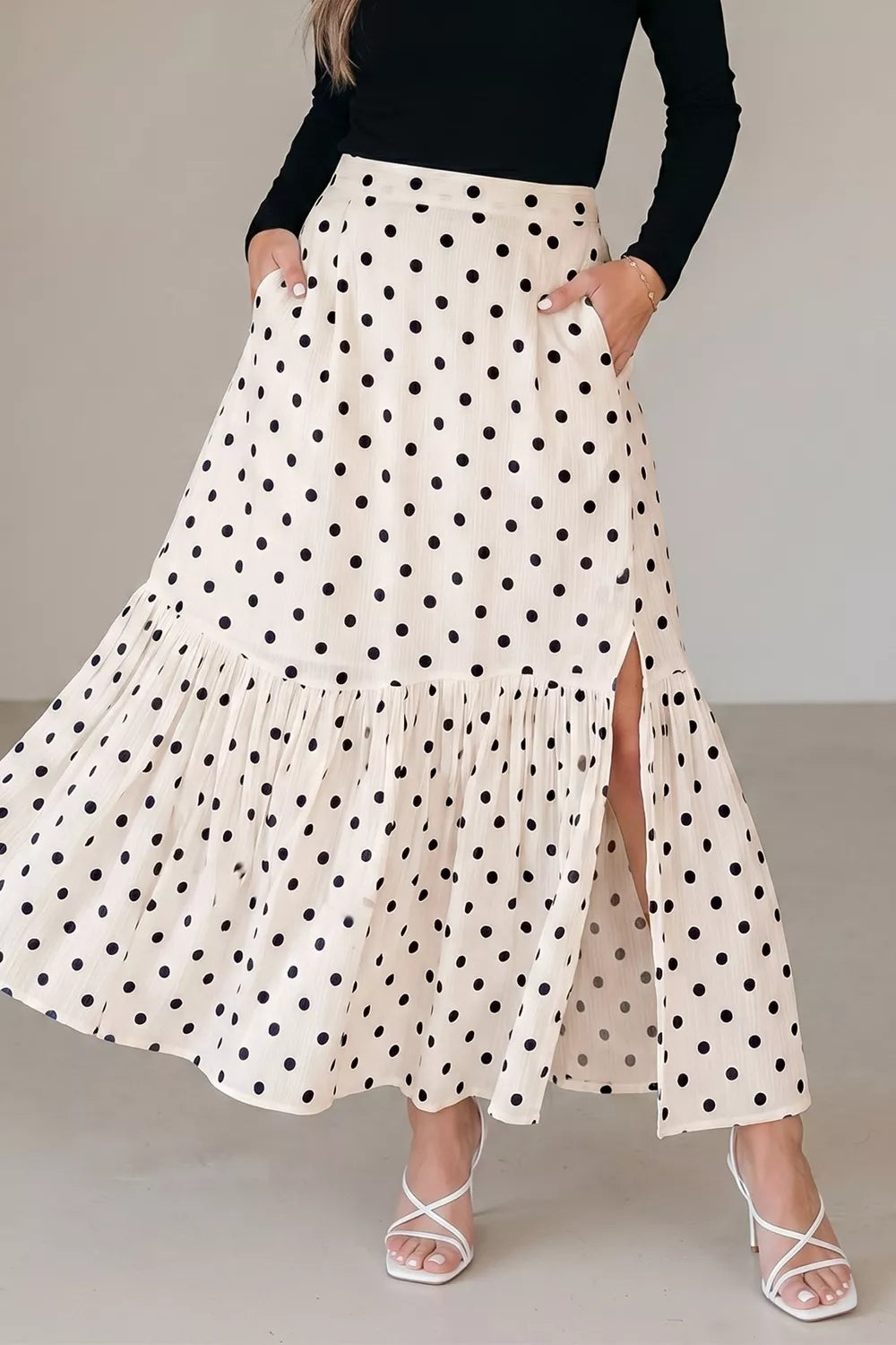 Discover the Polka Dot Ruffled Slit Maxi Skirt at HT Marlowe. Lightweight, stylish, and available in sizes S to XL. Enjoy free shipping on qualifying orders!