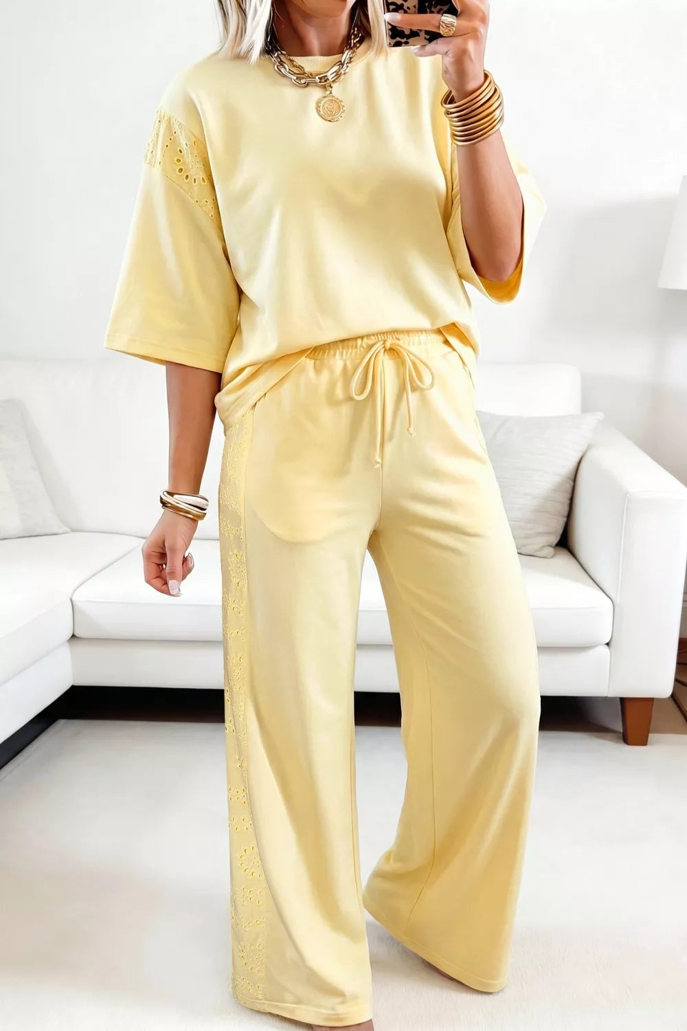 Person wearing a yellow outfit in a living room setting HT Marlowe