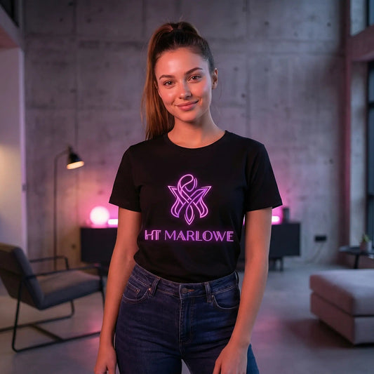 Woman wearing a black t-shirt with a logo and text in a modern indoor setting